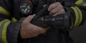 Firefighter holding hose